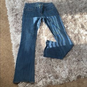 Dark wash boot cut low rise jeans
